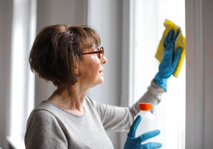 Woman Wiping Windows