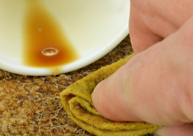 Blotting Out coffee spill on Carpet with Microfibre Rag