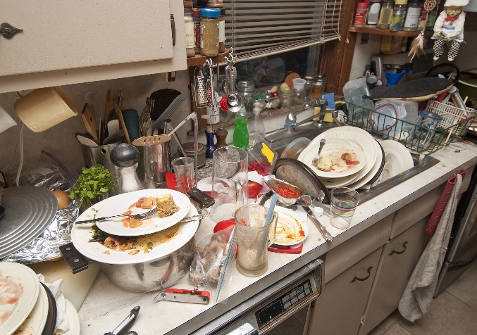 Kitchen Sink Filled with Soiled Plates