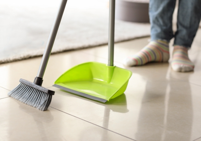 Sweeping the tiled floor
